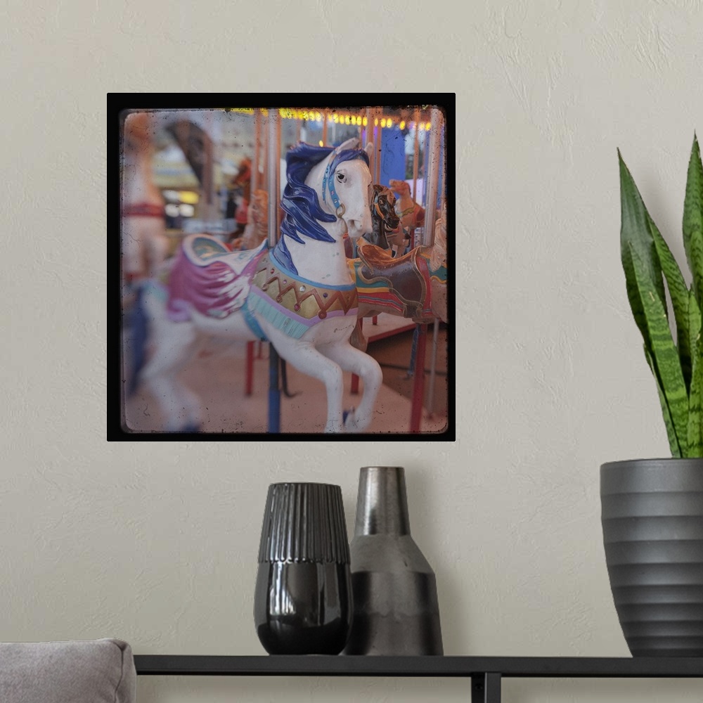 A modern room featuring Square image of a horse on a carousal with a blurred focus.