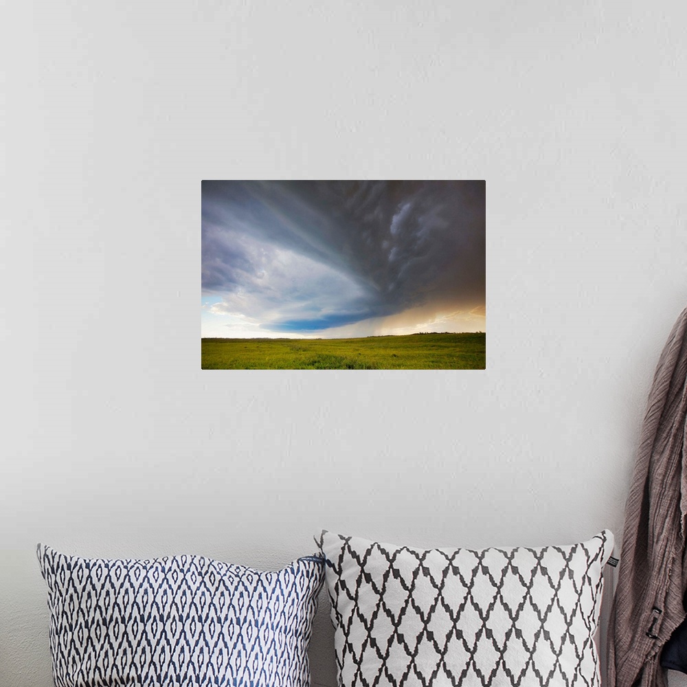 A bohemian room featuring Pictorial photograph of cloud formations during a severe prairie thunderstorm.
