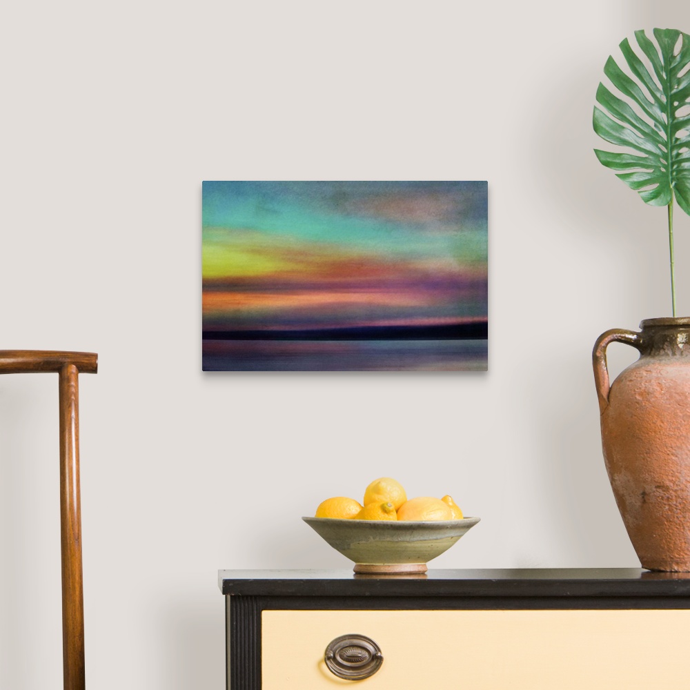 A traditional room featuring Fine art photograph of an evening skyscape with bright colors from the setting sun.