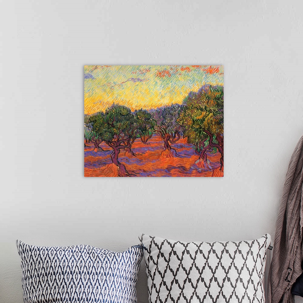 A bohemian room featuring Painting of tree filled meadow.