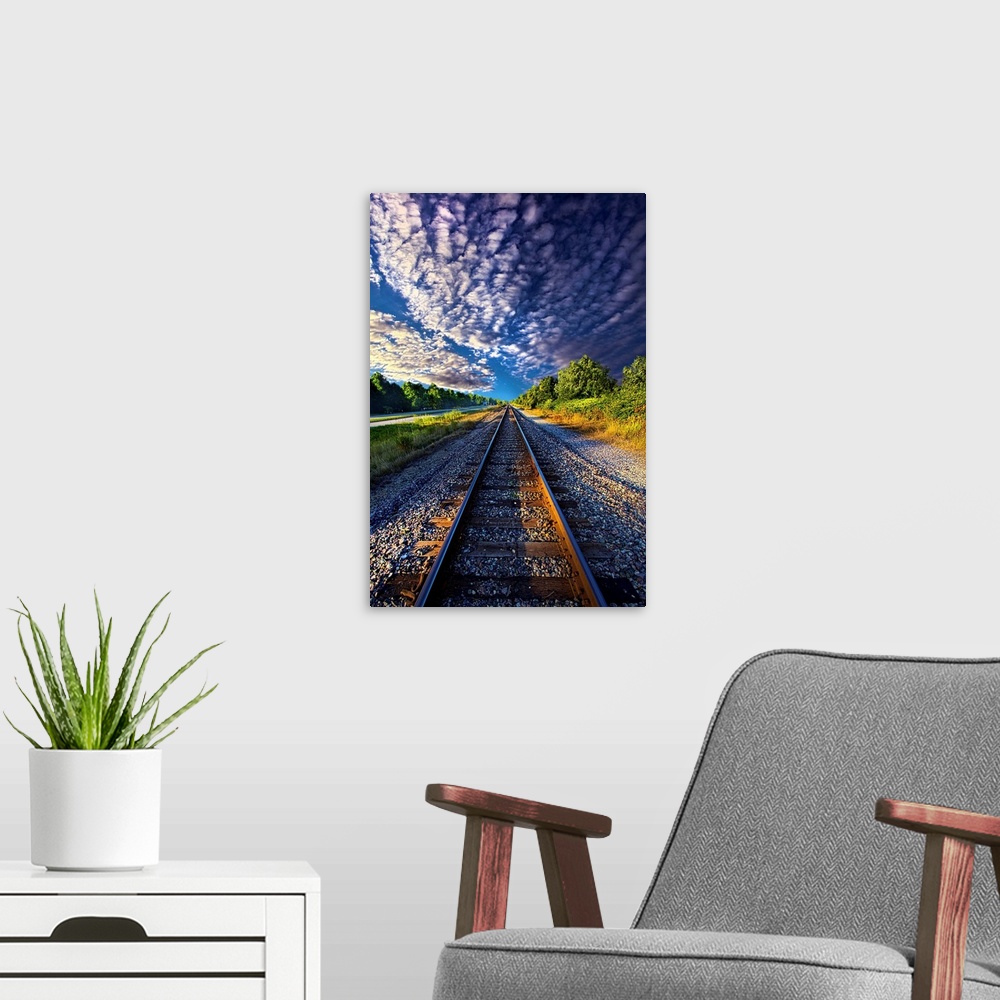 A modern room featuring Dramatic cloudscape over railroad tracks in the countryside of Wisconsin.