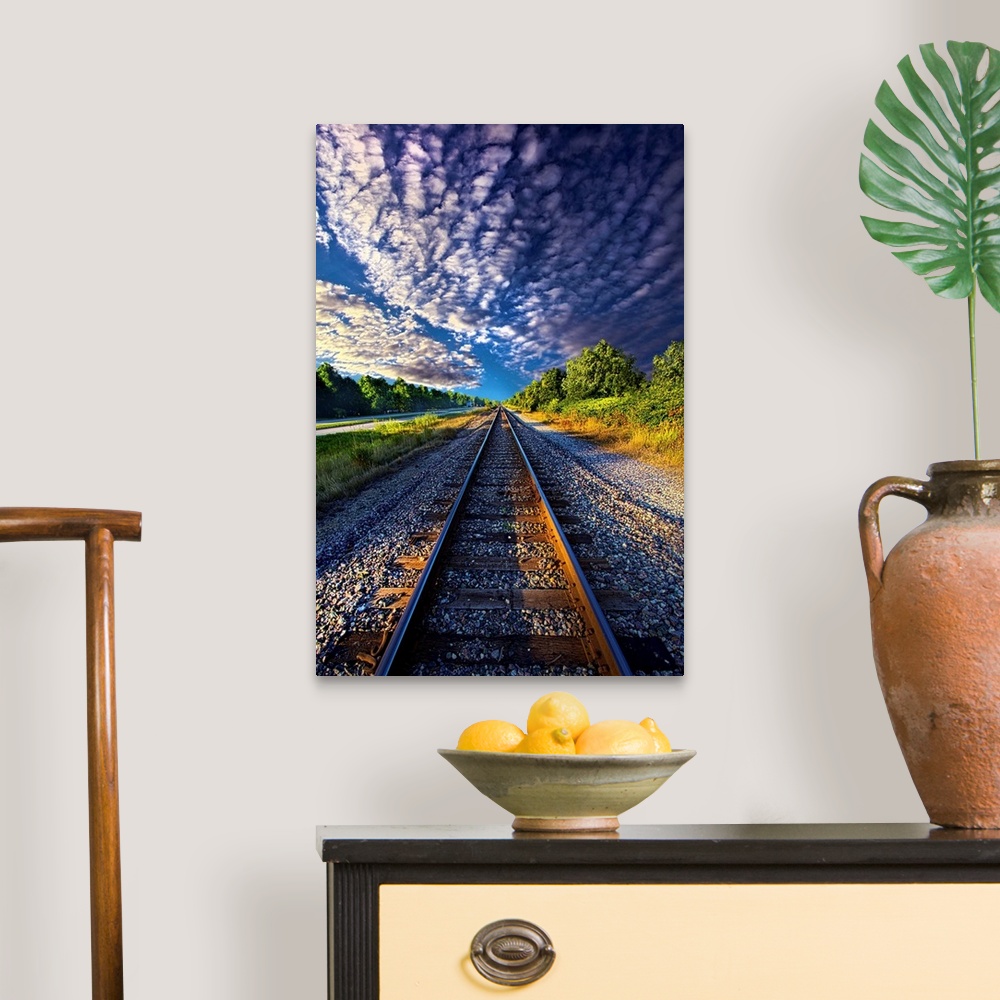 A traditional room featuring Dramatic cloudscape over railroad tracks in the countryside of Wisconsin.