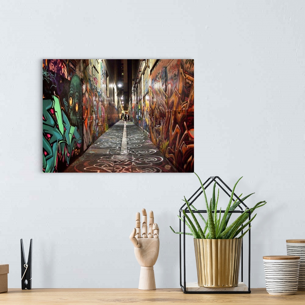 A bohemian room featuring Photograph of an alley with its walls covered in graffiti.