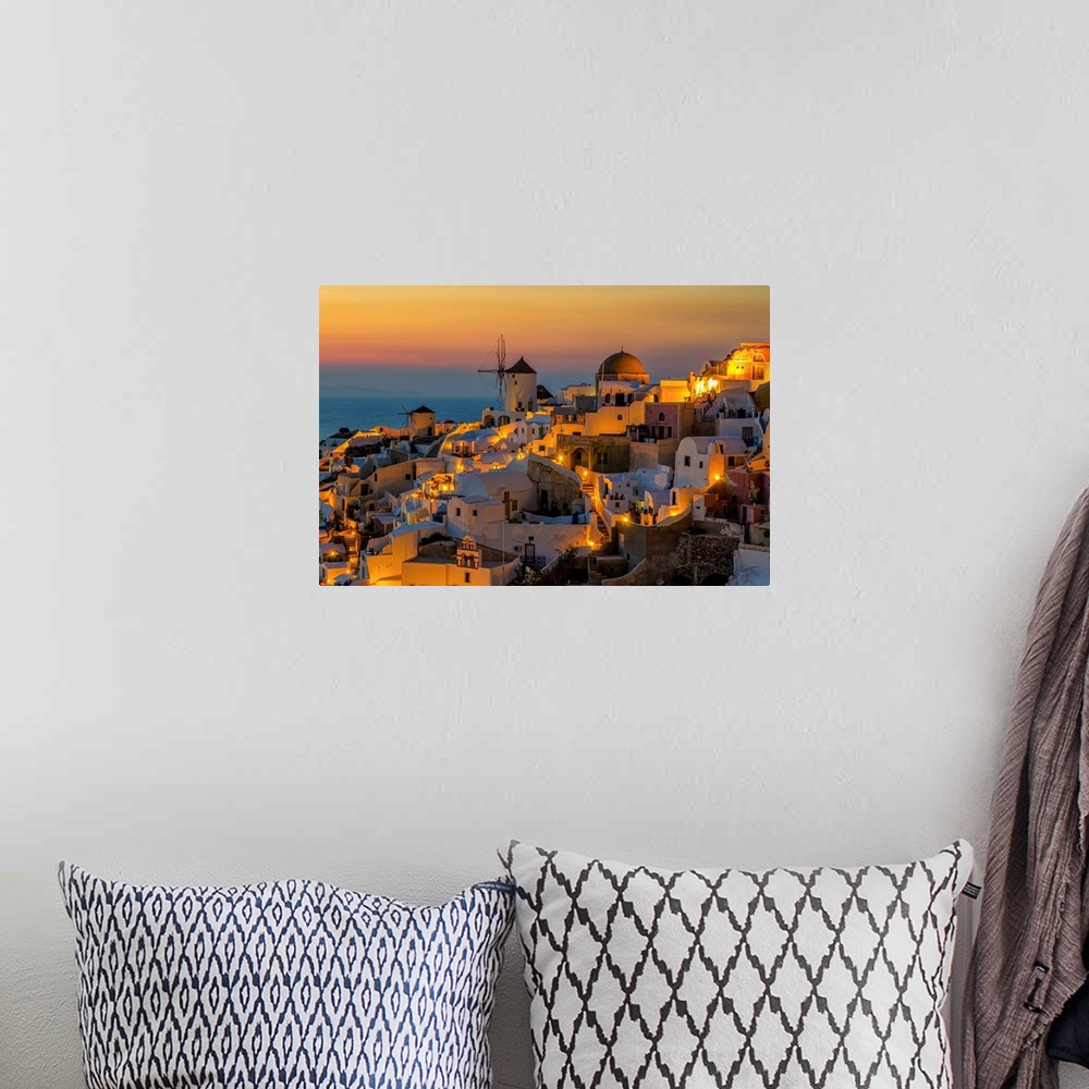 A bohemian room featuring Sunset moment in Oia village, Santorini island, Greece.
