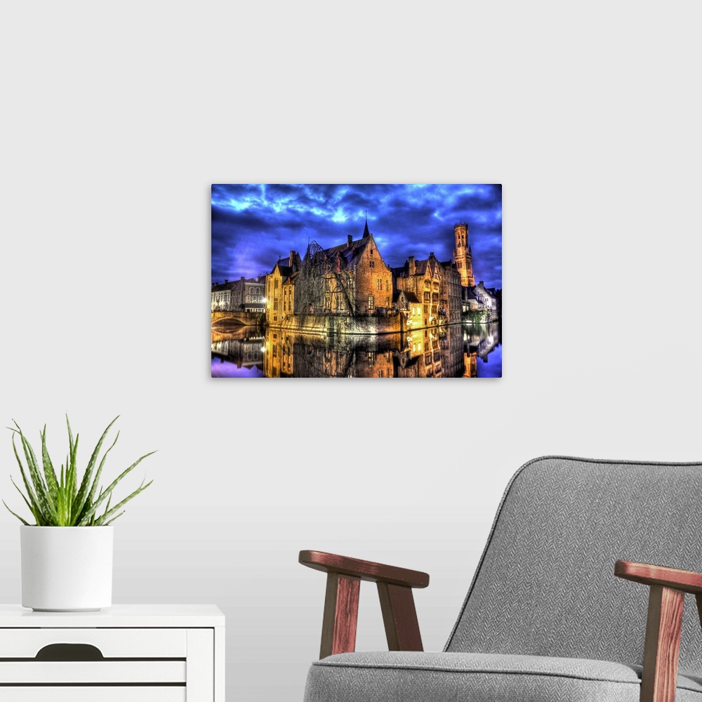 A modern room featuring A fantastic view point of the Belfry tower in Bruges and the canal.