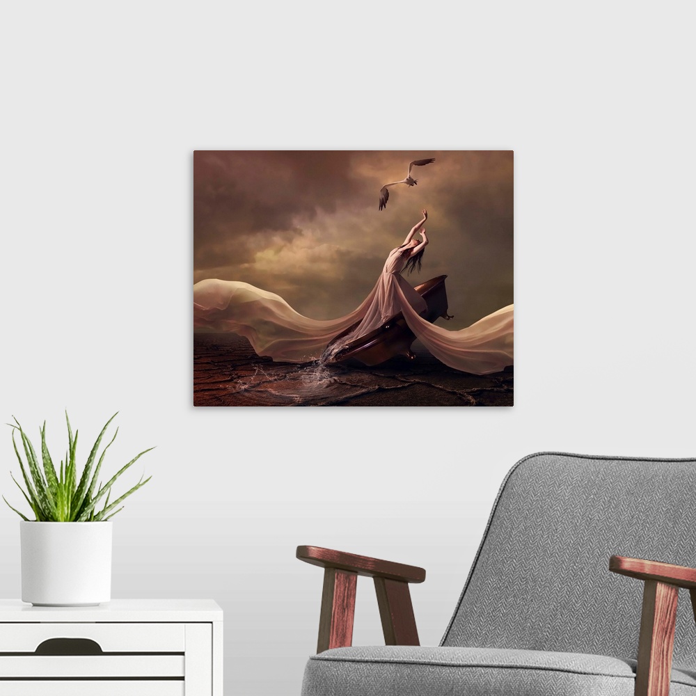 A modern room featuring Image of a woman in a long flowing dress with her arms raised towards a bird i nthe sky, on a roc...