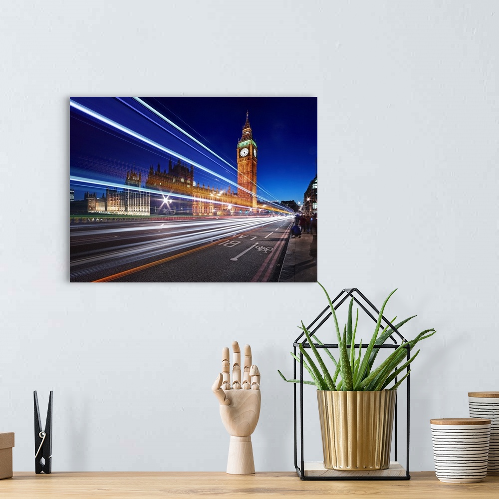 A bohemian room featuring Light trails from passing cars in front of Big Ben and Parliament in London, England, in the even...