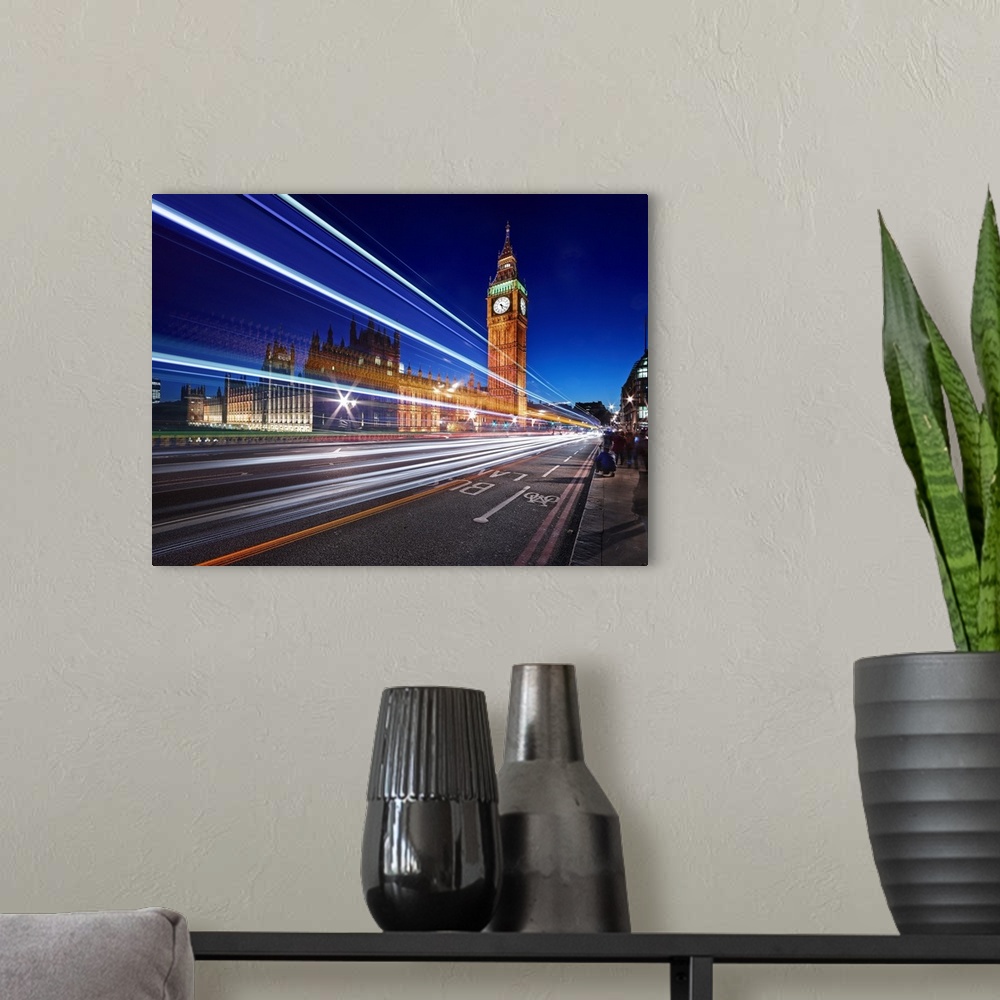 A modern room featuring Light trails from passing cars in front of Big Ben and Parliament in London, England, in the even...