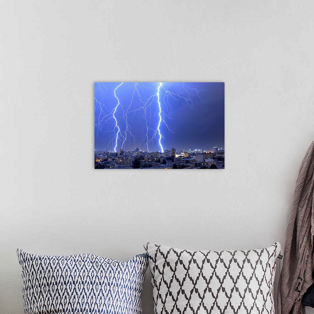 A bohemian room featuring Multiple exposures of lightning strikes over Bucharest, Romania.