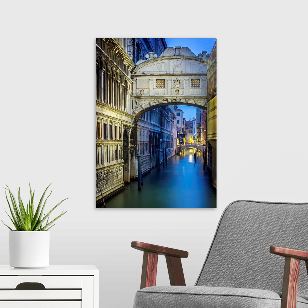A modern room featuring Early morning in Venice, the canal under the Bridge of Sighs.
