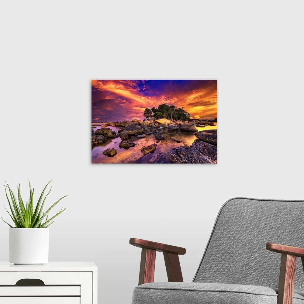 A modern room featuring Photograph of sunset sky lit up in a blaze of sunlight.
