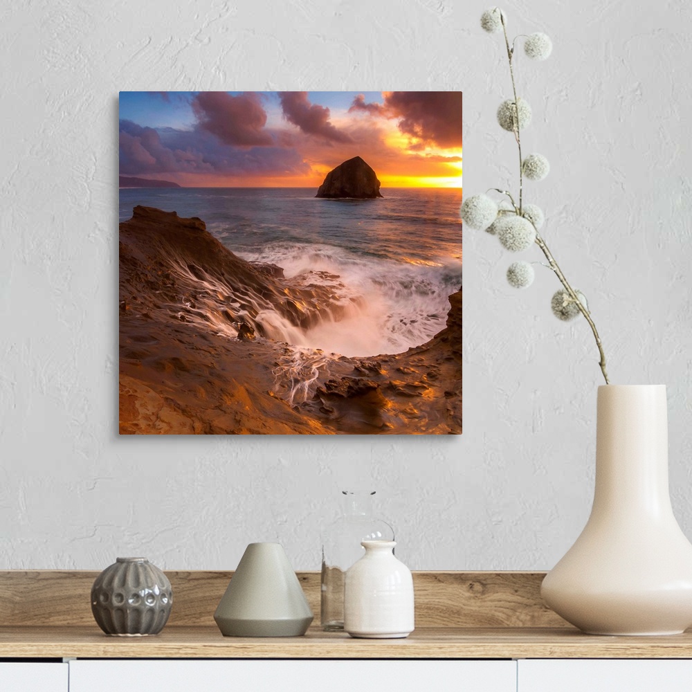 A farmhouse room featuring Haystack Rock in the ocean at sunset, seen from the shore at Cape Kiwanda, Oregon.