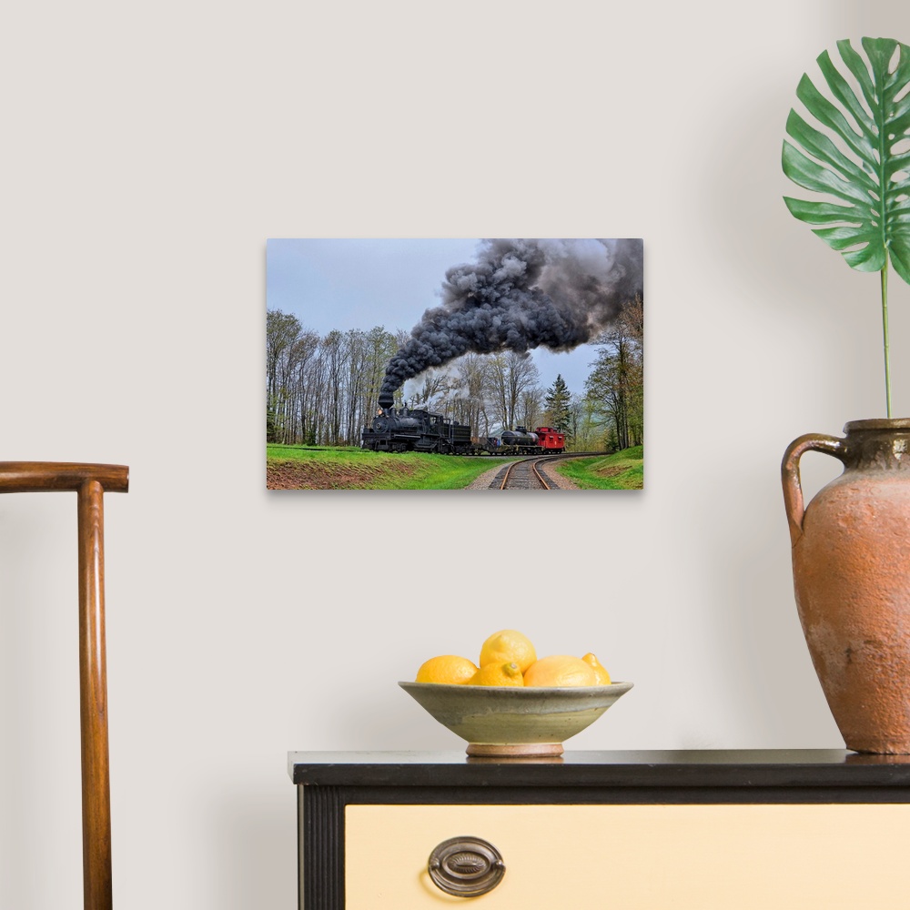 A traditional room featuring A locomotive with billowing black smoke climbs up a hill.