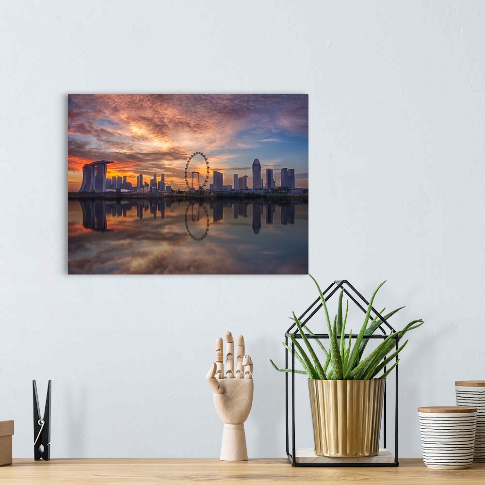 A bohemian room featuring A unique view of the Singapore skyline at sunset.