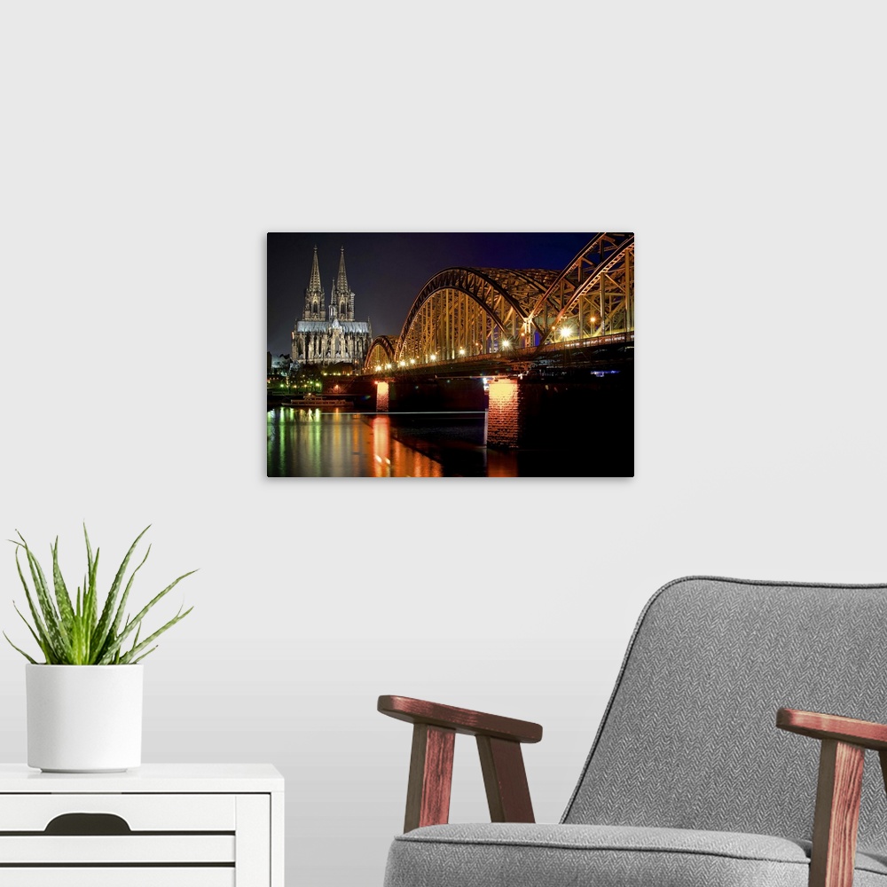 A modern room featuring Cologne at Night, Hohenzollern Bridge and Cologne Cathedral.