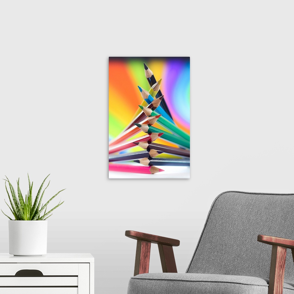 A modern room featuring Colored pencils arranged in a pile, with rainbow colors.