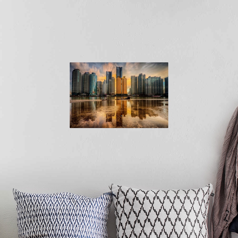 A bohemian room featuring Dramatic photograph of a city skyline with immense skyscraper reflected in a puddle in the foregr...
