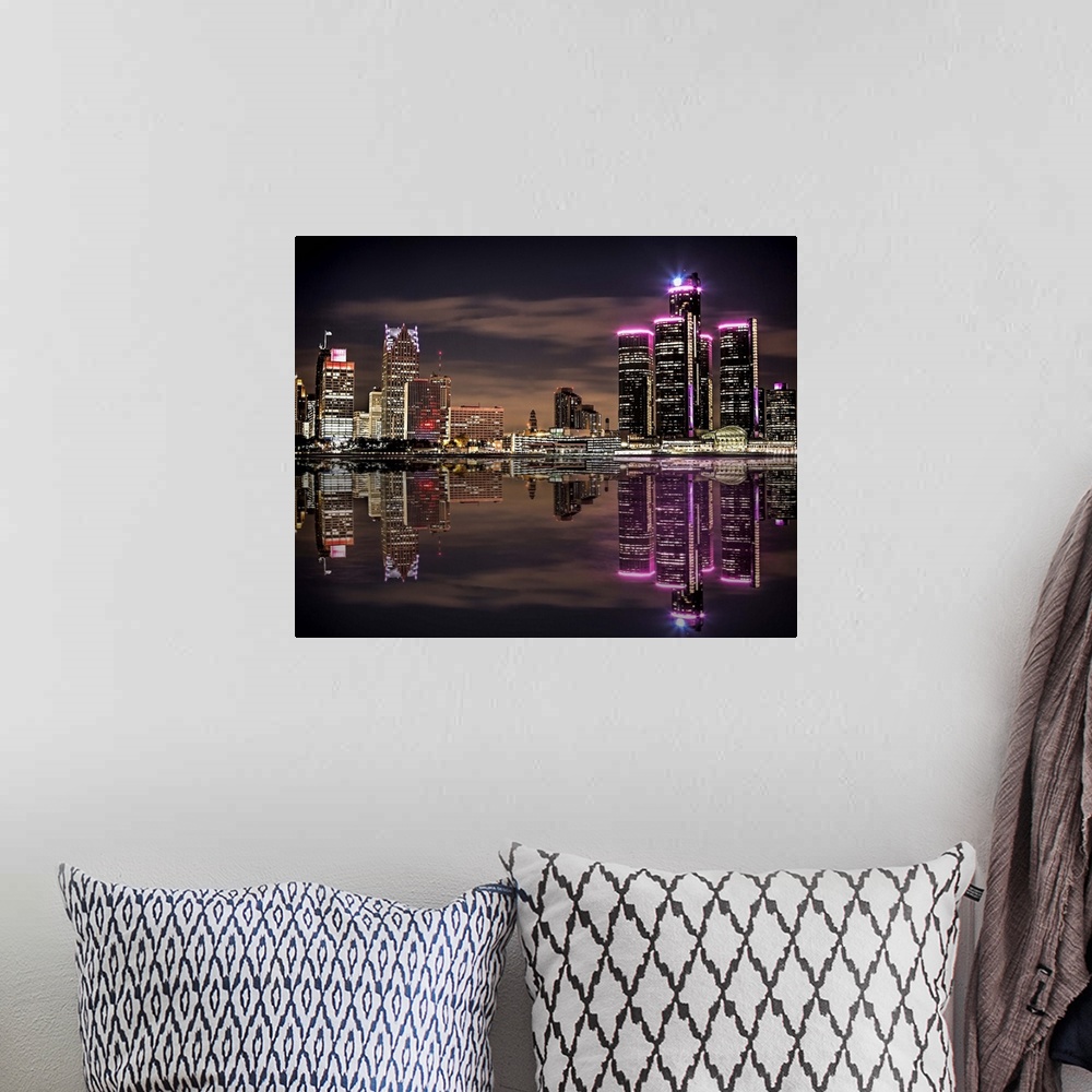 A bohemian room featuring The Detroit skyline as seen from Windsor at night.