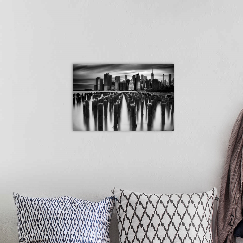 A bohemian room featuring New York City skyline seen from the harbor, in black and white.