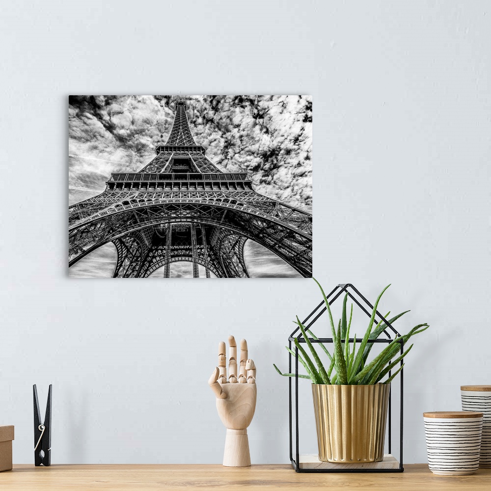 A bohemian room featuring High contrast black and white photo of the Eiffel Tower.
