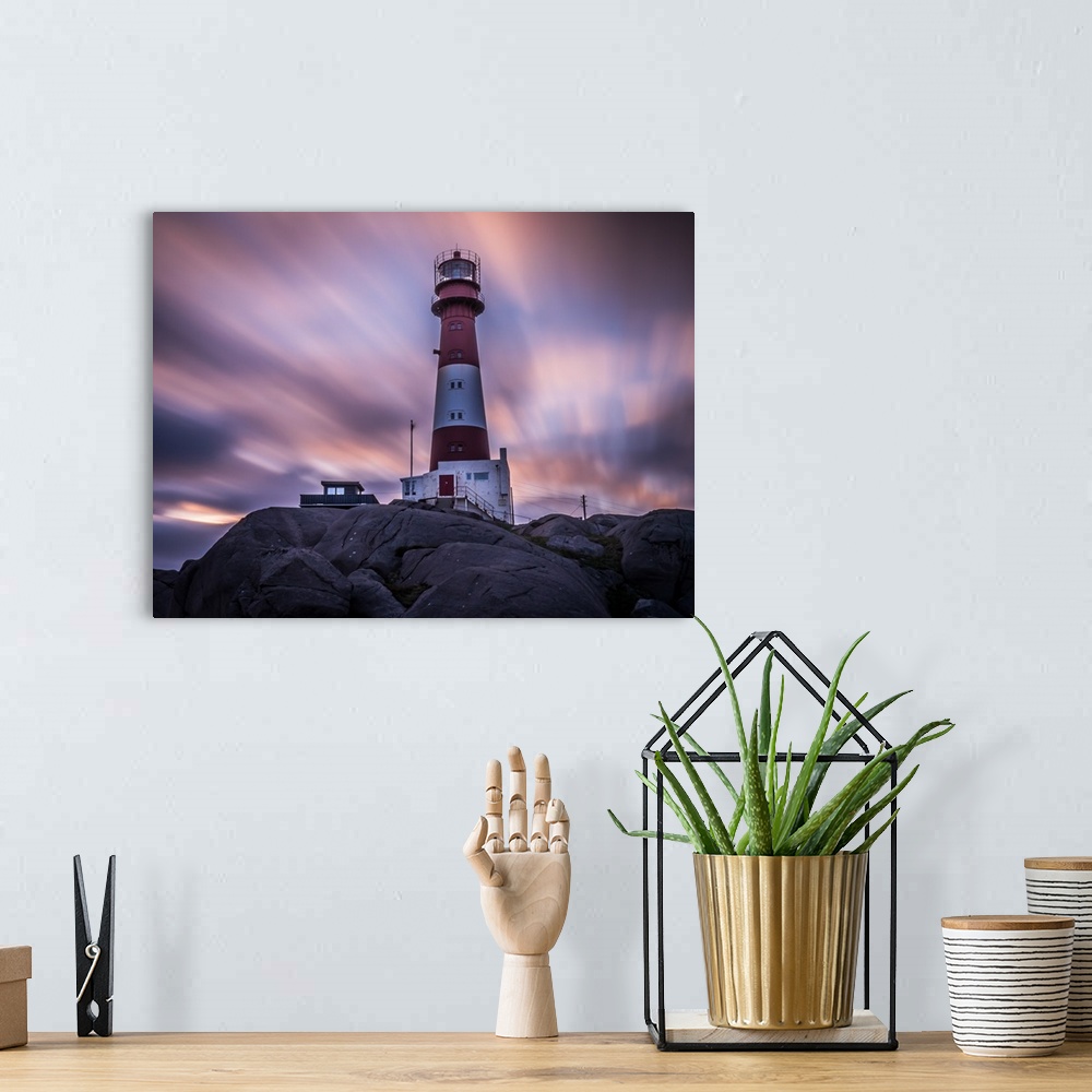 A bohemian room featuring Lighthouse on the coast at Eigeroya, Norway, at sunset.