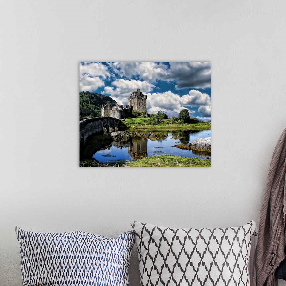 A bohemian room featuring A river and Eilan Donan Castle, Scotland, under a cloudy sky.