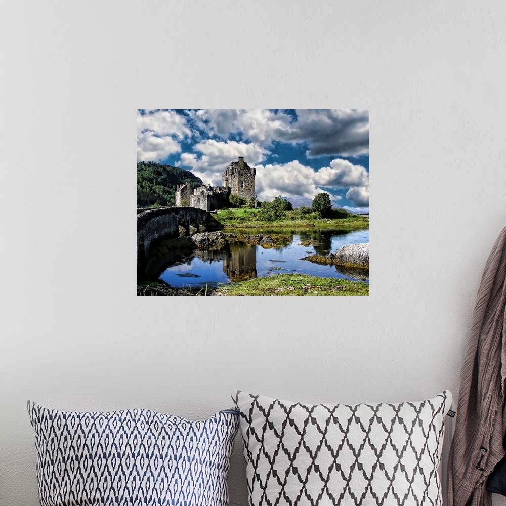 A bohemian room featuring A river and Eilan Donan Castle, Scotland, under a cloudy sky.