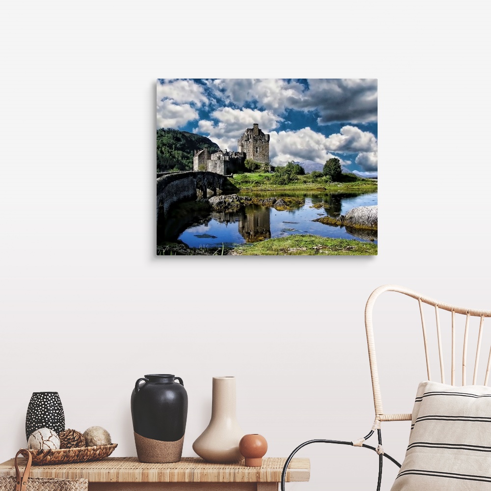 A farmhouse room featuring A river and Eilan Donan Castle, Scotland, under a cloudy sky.