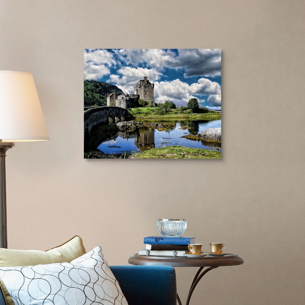 A traditional room featuring A river and Eilan Donan Castle, Scotland, under a cloudy sky.