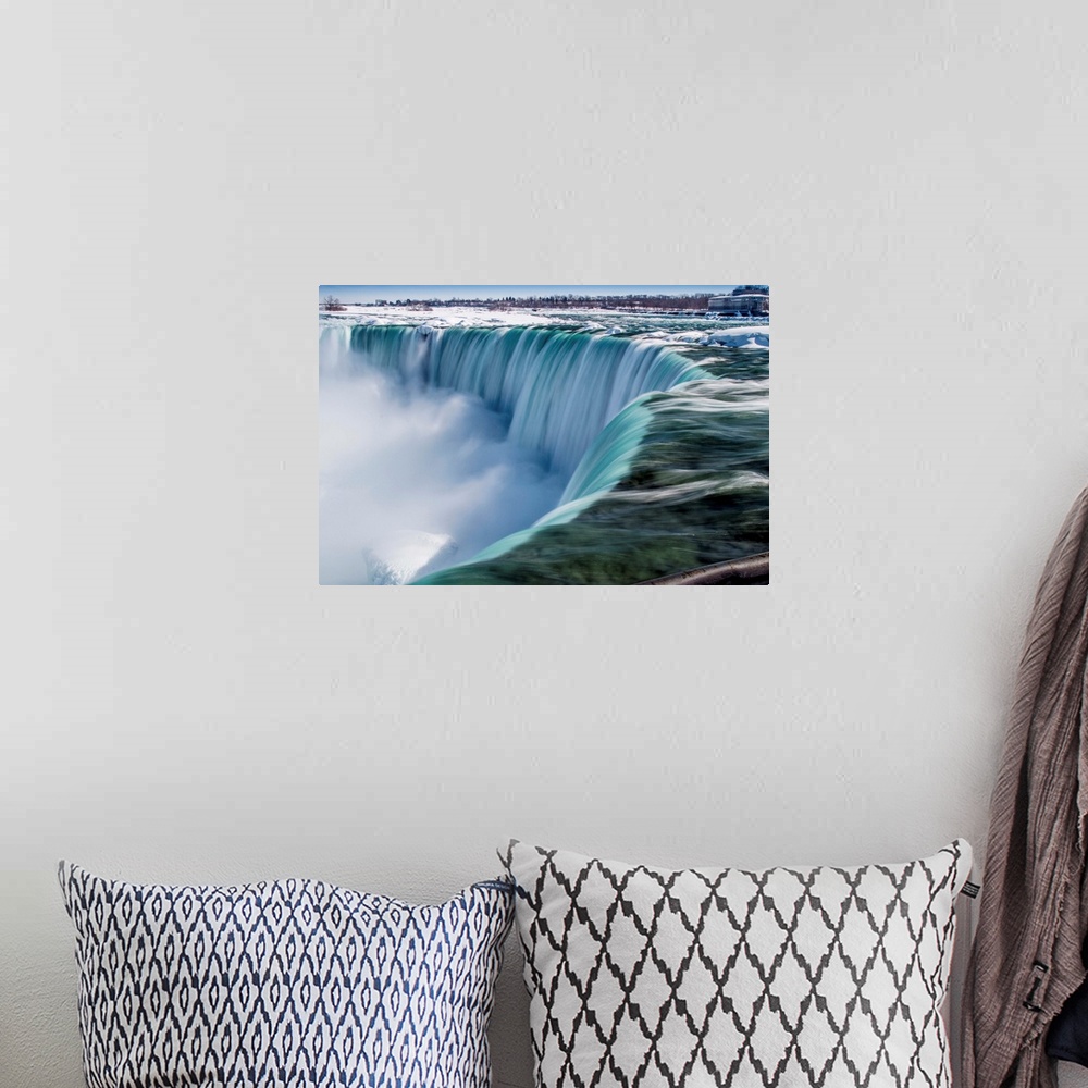 A bohemian room featuring The impressive Niagara Falls in February.