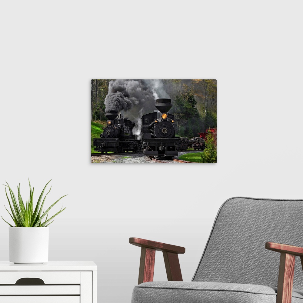 A modern room featuring Two large locomotives on the tracks with smoke billowing out of their smokestacks.