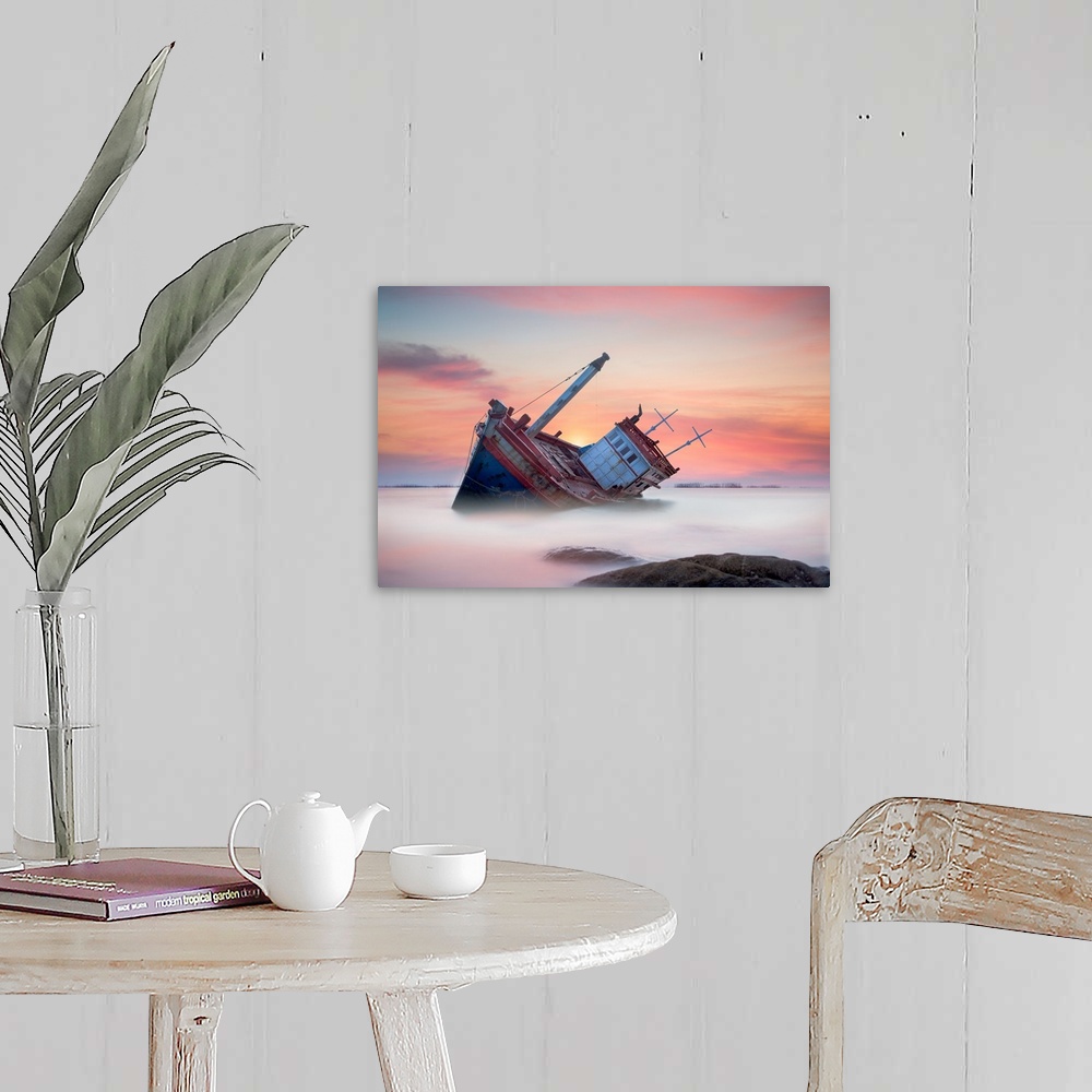 A farmhouse room featuring Fishing boat beached in the shallow water, seen at sunset.