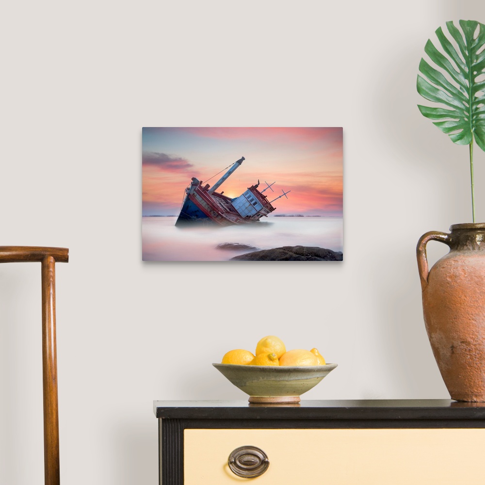 A traditional room featuring Fishing boat beached in the shallow water, seen at sunset.