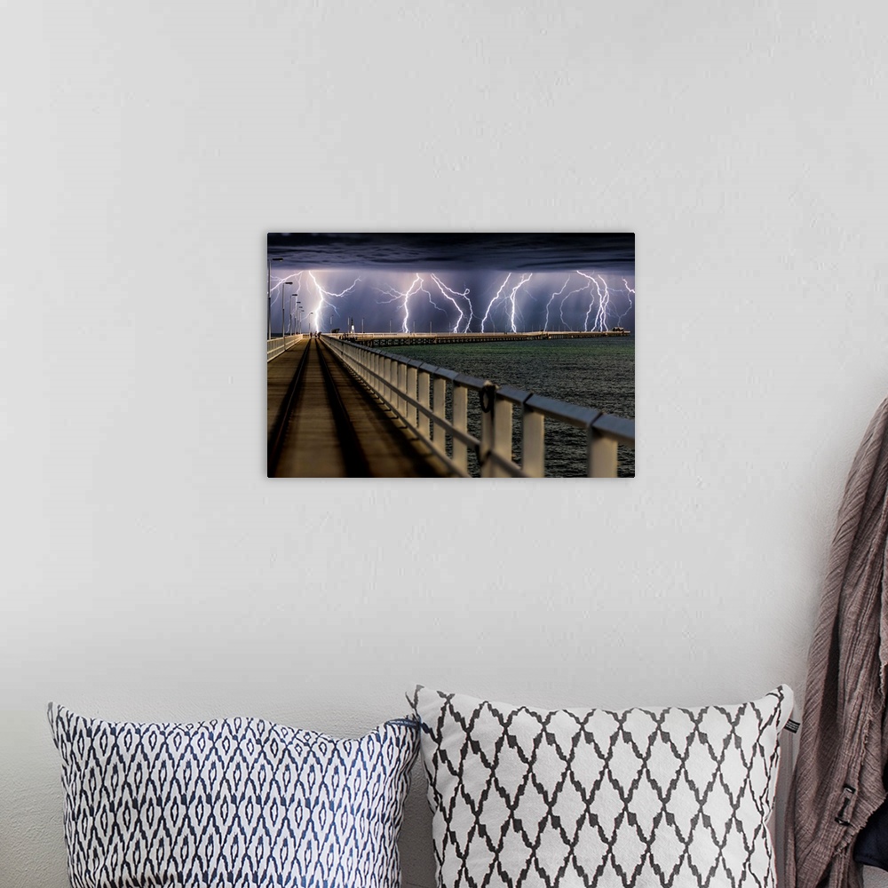 A bohemian room featuring Busselton Jetty, Western Australia, during an intense lightning storm.
