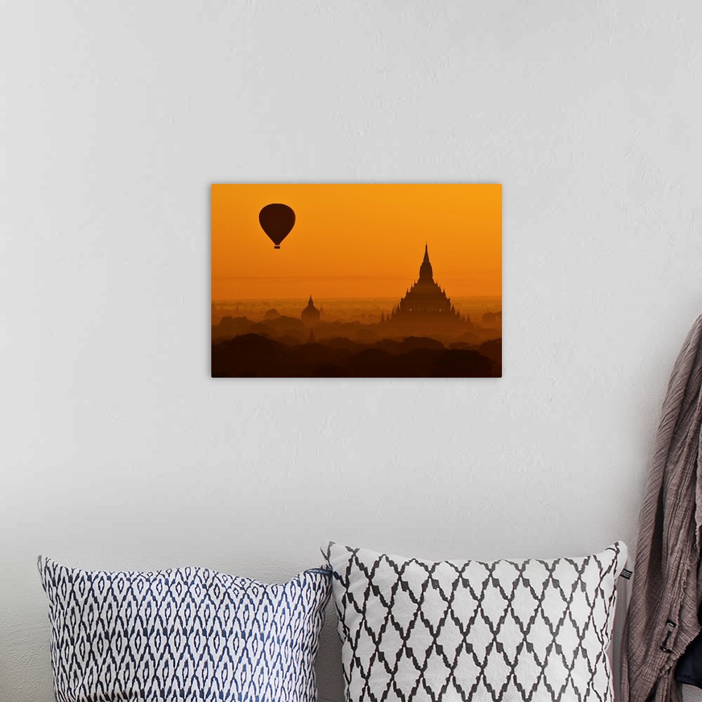 A bohemian room featuring Silhouette of a balloon over temples in the morning in Bagan, Myanmar