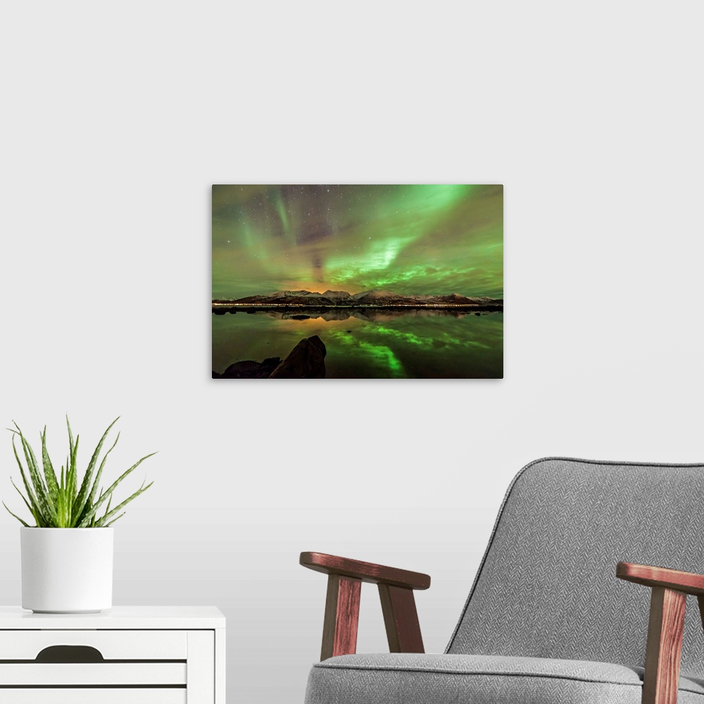 A modern room featuring Northern lights seen from Buksnes, Andoya island. Skjoldehamn at the other side, Norway.