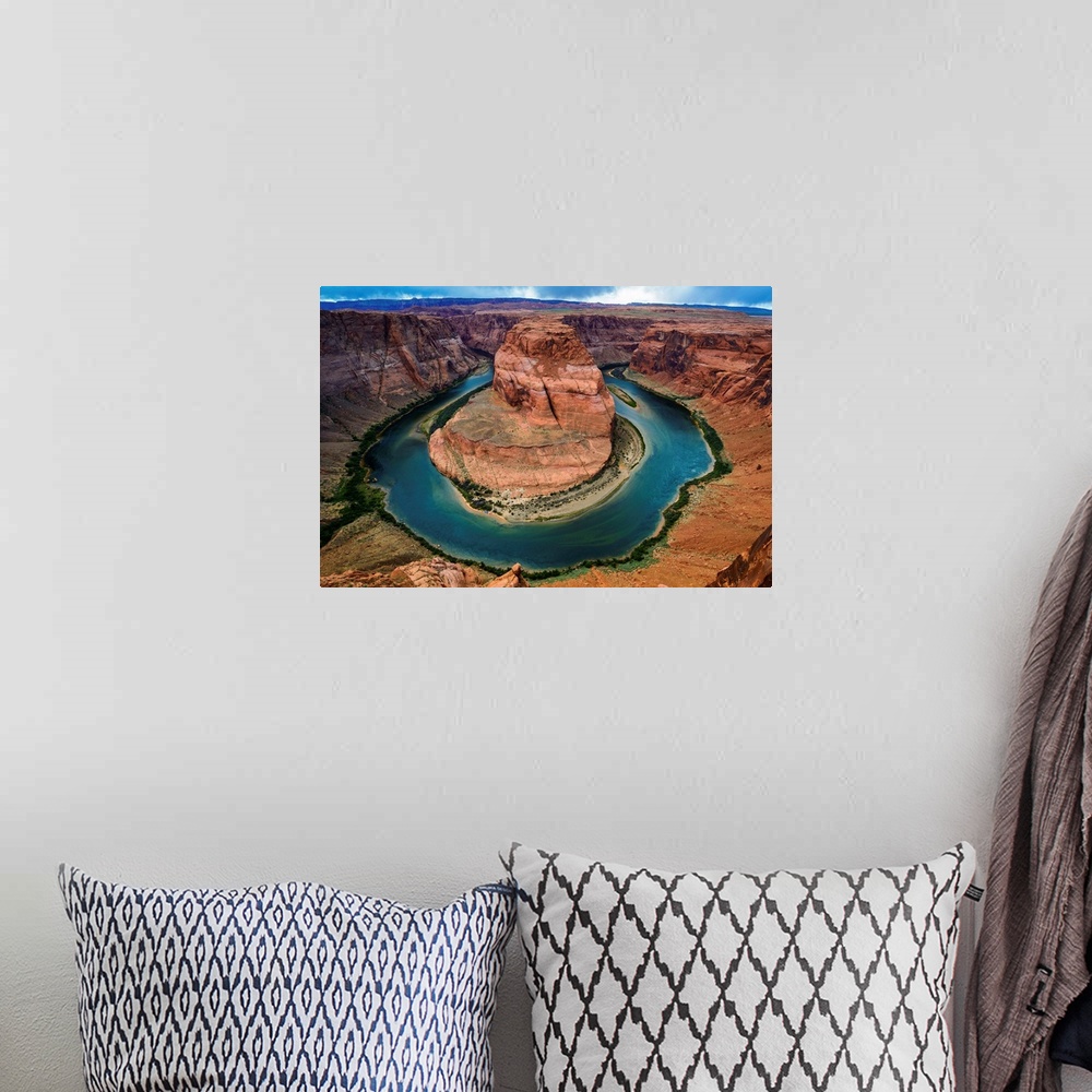 A bohemian room featuring Horseshoe Bend section of the Colorado River with partly cloudy skies and rain in the distance.