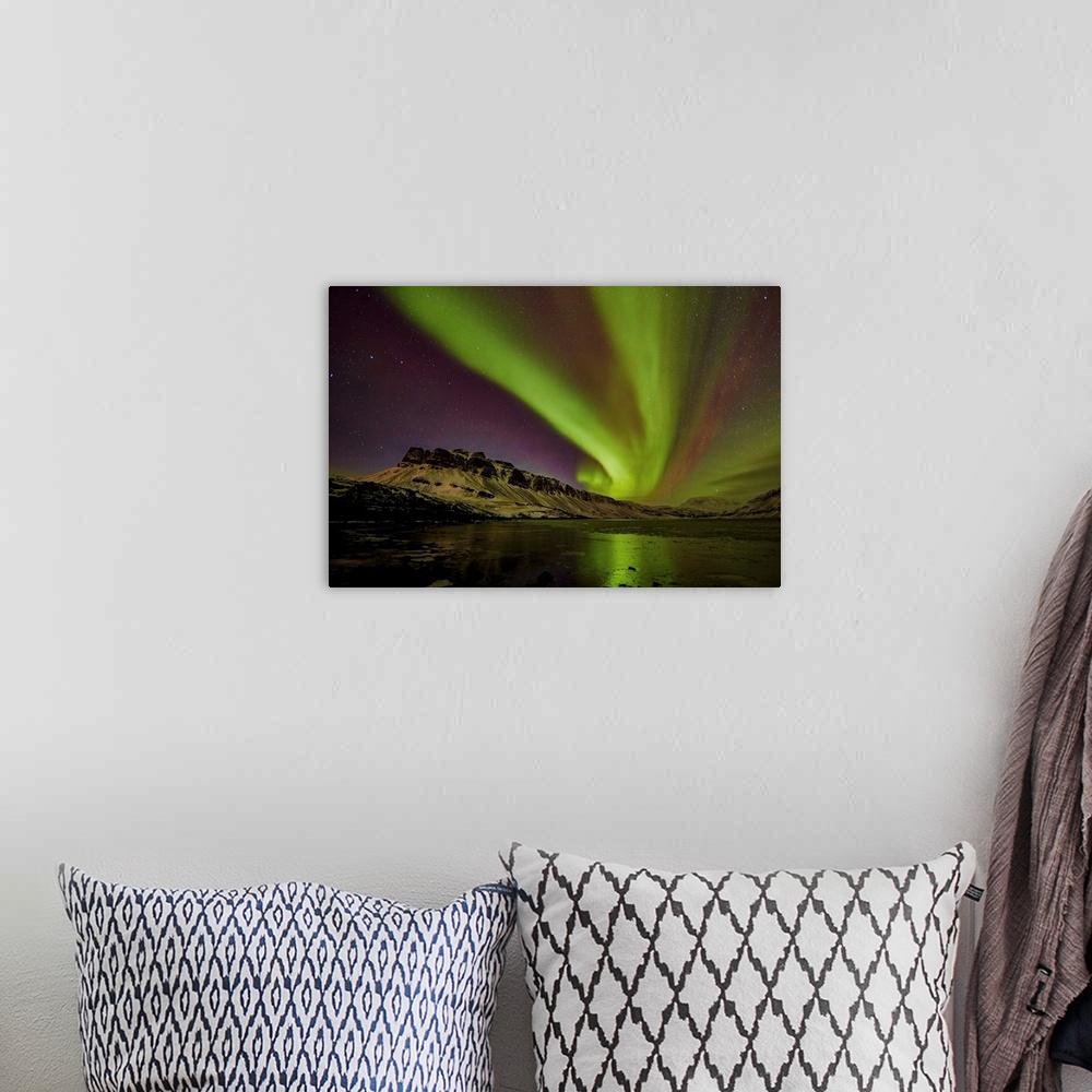 A bohemian room featuring Aurora borealis in Hvalfordur, West Iceland.