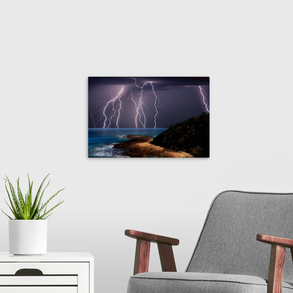 A modern room featuring Lightning strikes over the sea, Great Ocean Road, Victoria, Australia.