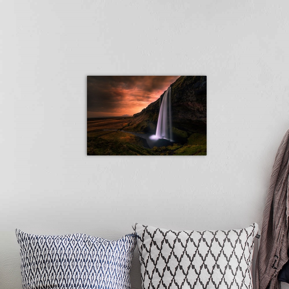 A bohemian room featuring Seljalandsfoss Waterfall in Southern Iceland in the evening.