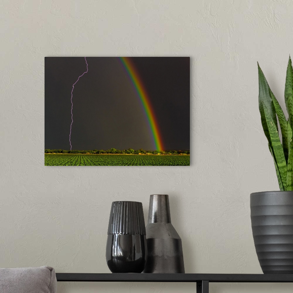 A modern room featuring Lightning strike and a rainbow in the sky over Kanoneiland, South Africa.