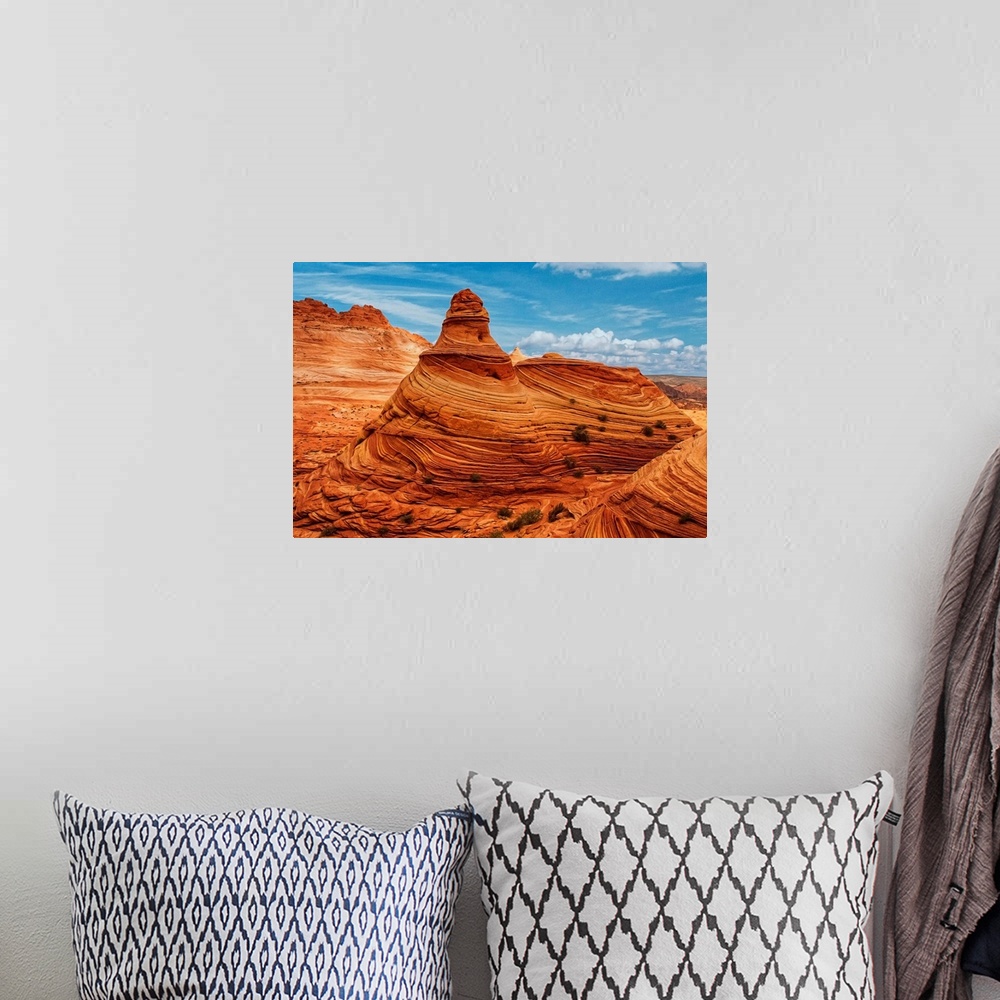 A bohemian room featuring A tall rock formation in the desert in Vermilion Cliffs, Arizona.