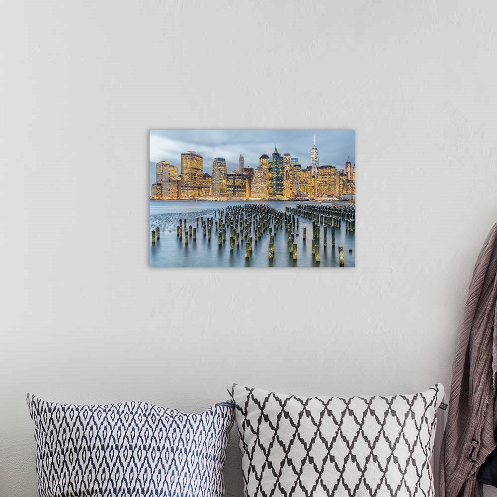 A bohemian room featuring Manhattan city skyline seen from the harbor in the late afternoon.