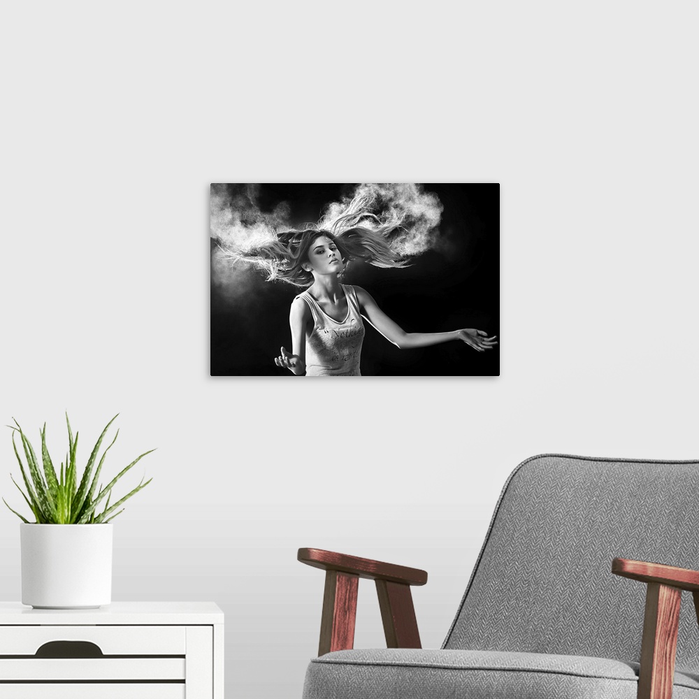 A modern room featuring Black and white portrait of a beautiful woman with hair swirling around her.