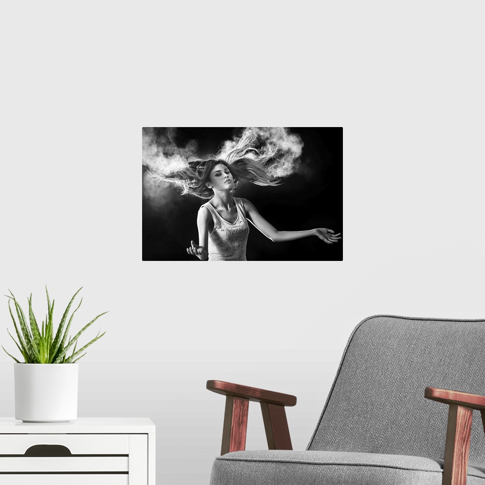 A modern room featuring Black and white portrait of a beautiful woman with hair swirling around her.