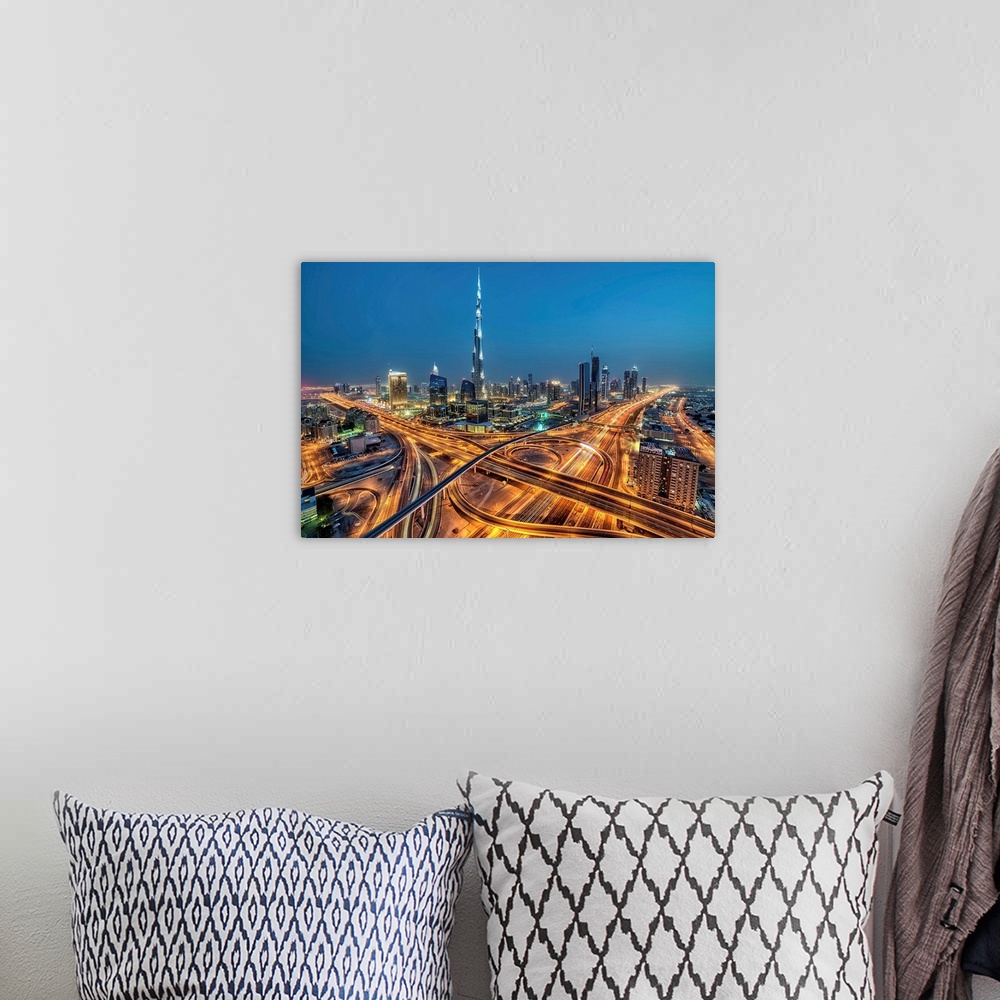 A bohemian room featuring Aerial view of Downtown Dubai illuminated at night.