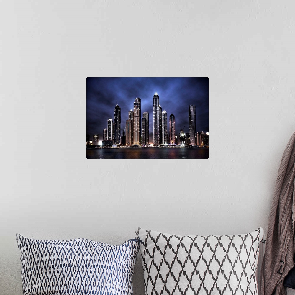 A bohemian room featuring The Dubai city skyline at night, United Arab Emirates.