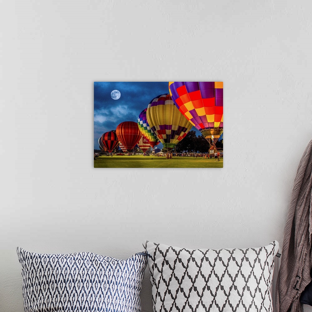 A bohemian room featuring Moon in the night sky over a row of colorful hot air balloons.