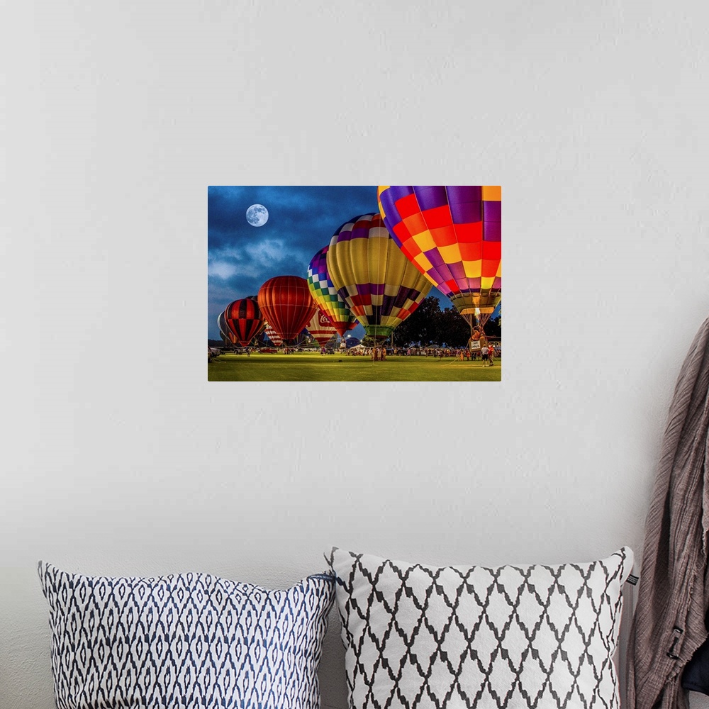 A bohemian room featuring Moon in the night sky over a row of colorful hot air balloons.
