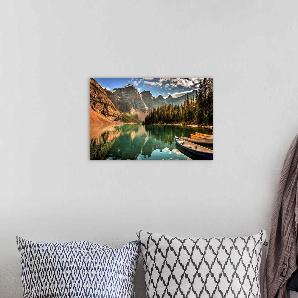 A bohemian room featuring Photograph of a still lake with canoes in the Canadian Rockies, Banff National Park.